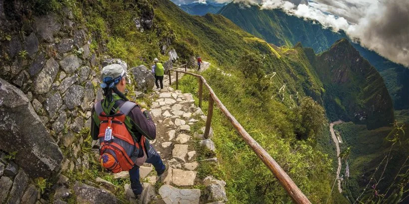 Tourist walking in MachuPicchu | Qoricancha Expedition