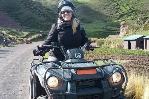 Tourist on ATV filling Rainbow Mountain. | Qoricancha Expeditions