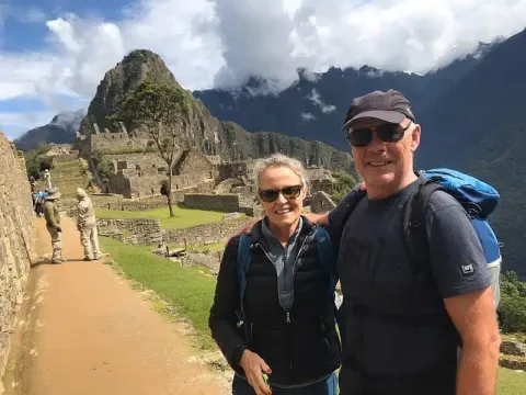 Tourist posing at MachuPicchu | Qoricancha Expedition