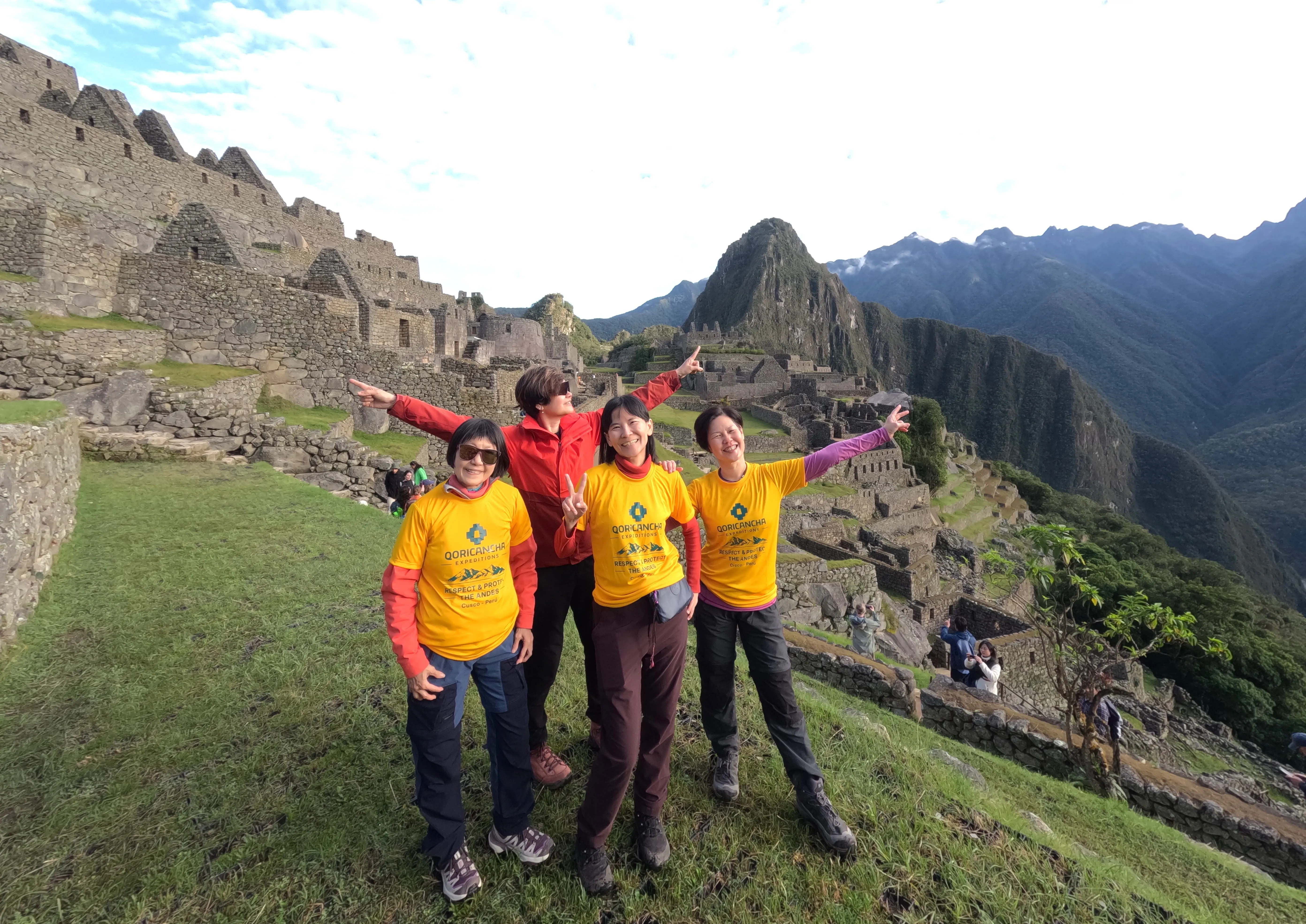 Happy travelers after their Machu Picchu guided tour | Qoricancha Expeditions