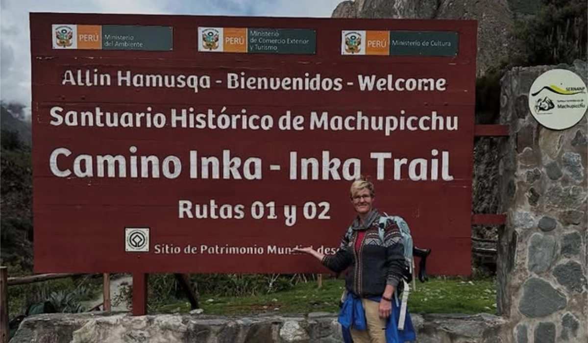 Tourists at the official Inca Trail starting point sign