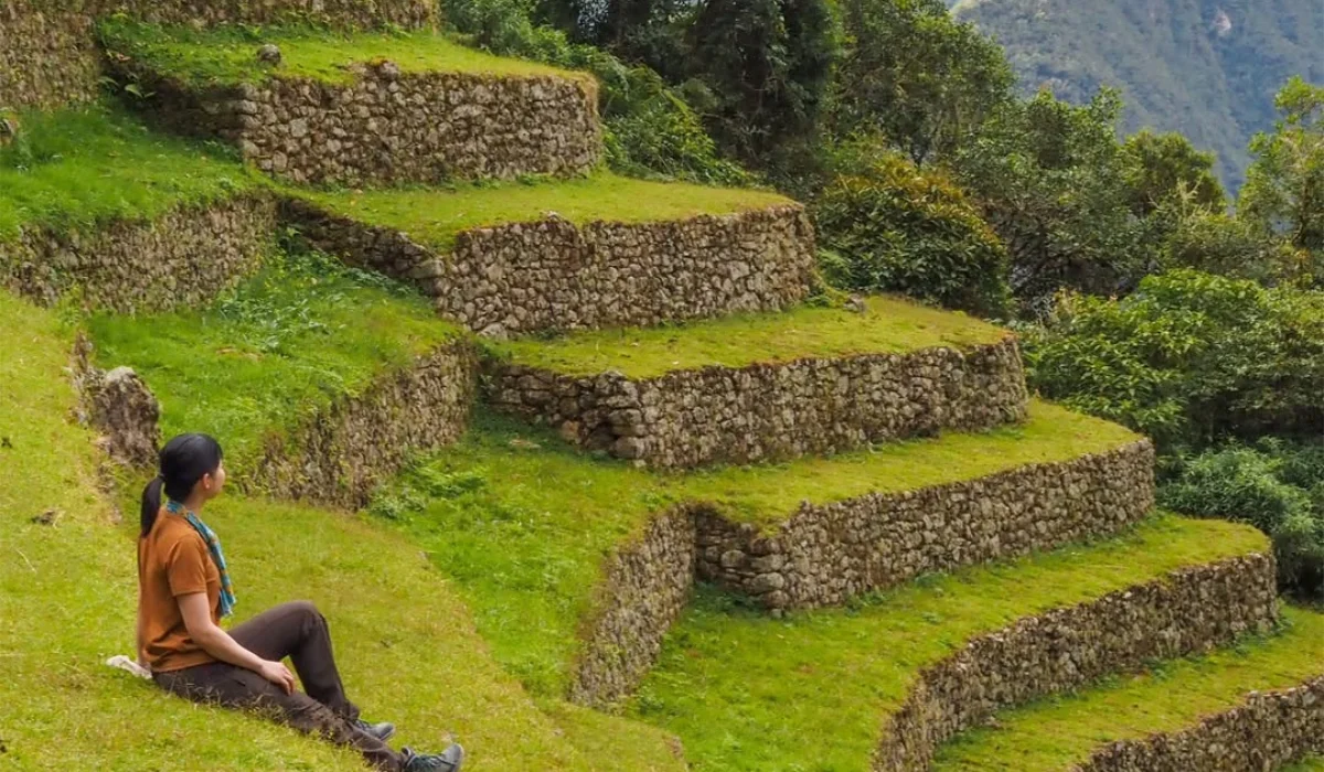 Traveler admiring Machu Picchu terraces