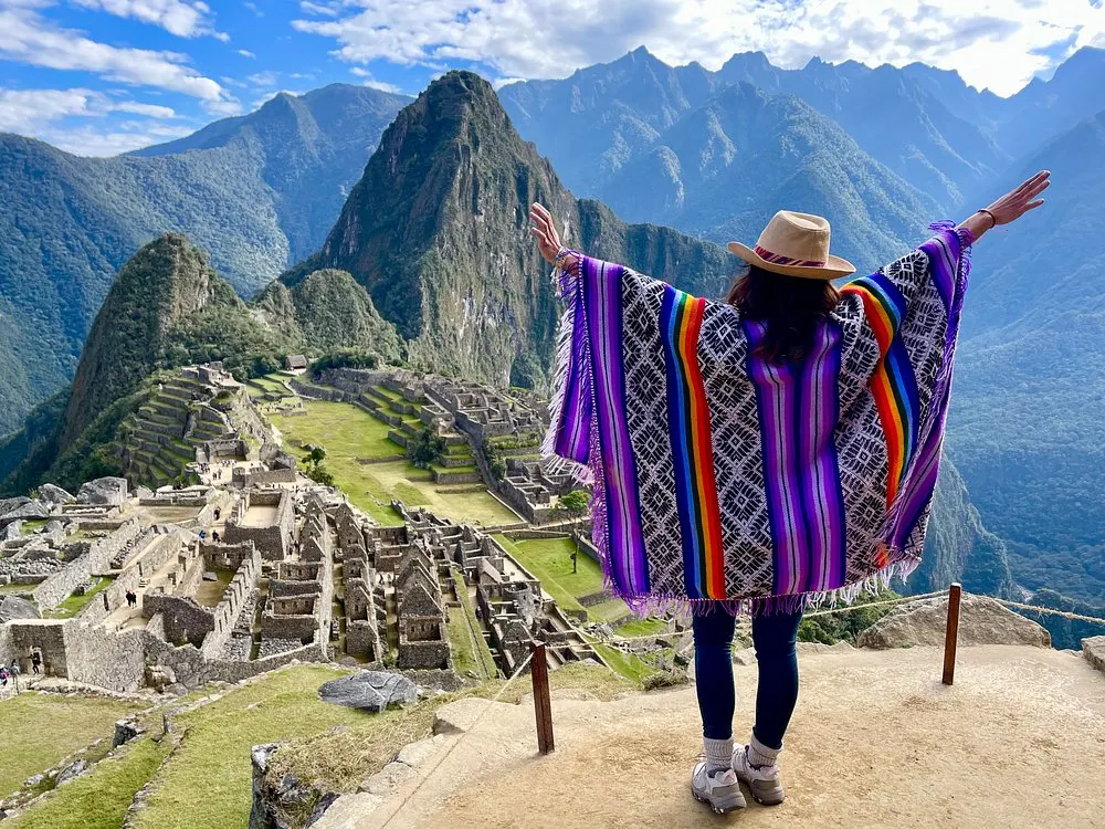 A couple posing with the Machu Picchu citadel in the background on the Circuit 2 route