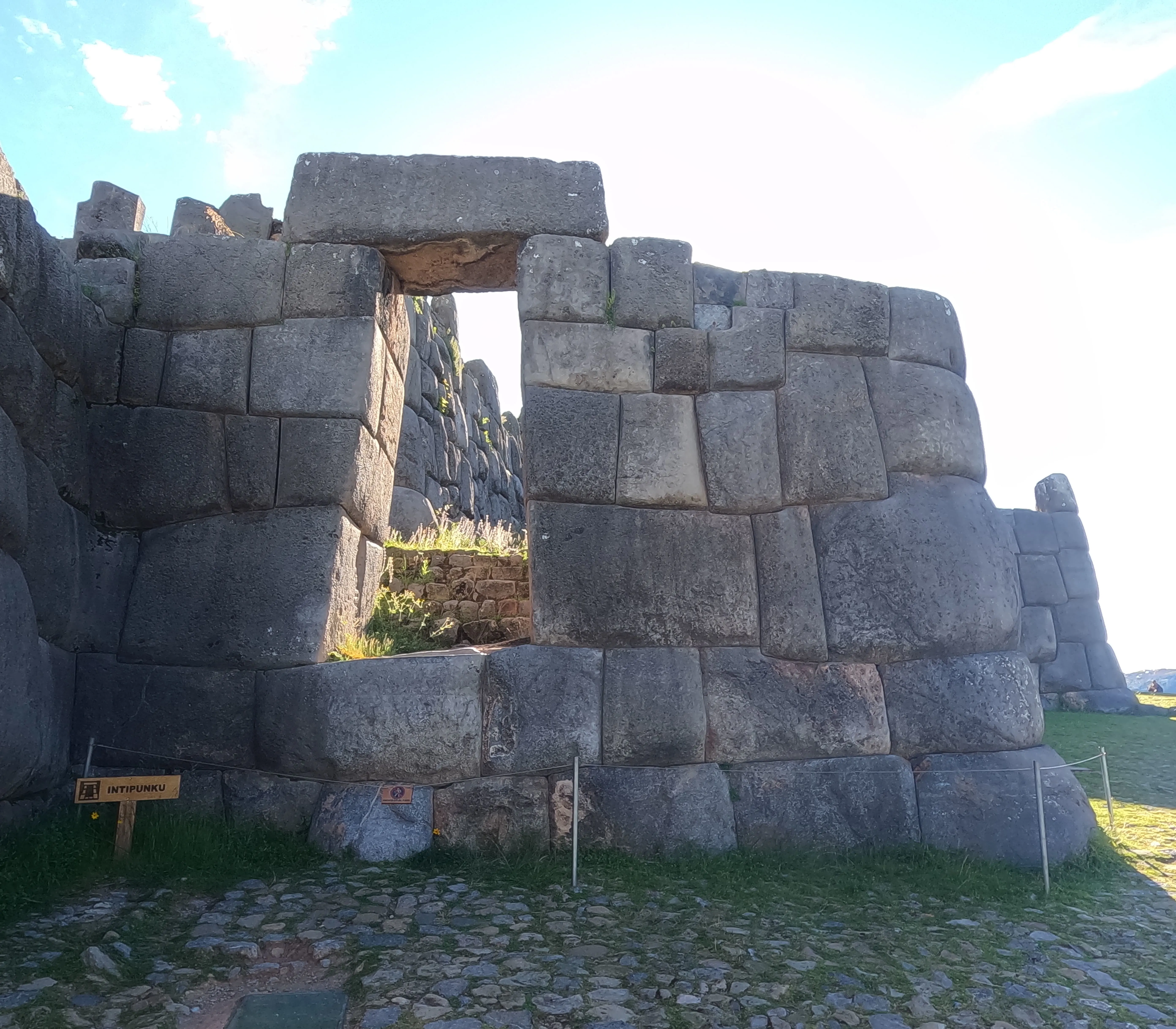 Stone gateway at Sacsayhuamán Inca site in Cusco.”