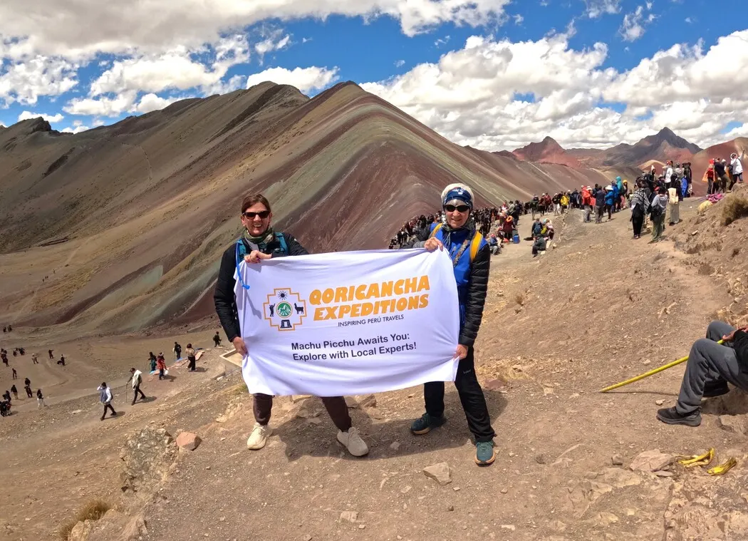 Clients at Rainbow Mountain Peru with vibrant mountain views