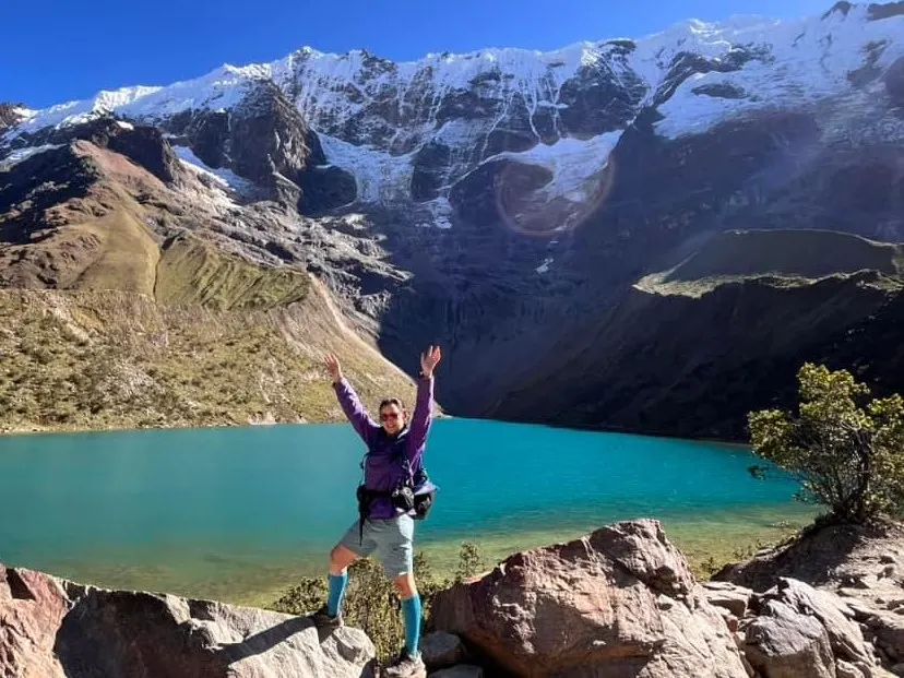 Travelers enjoying the turquoise waters of Humantay Lake in Cusco