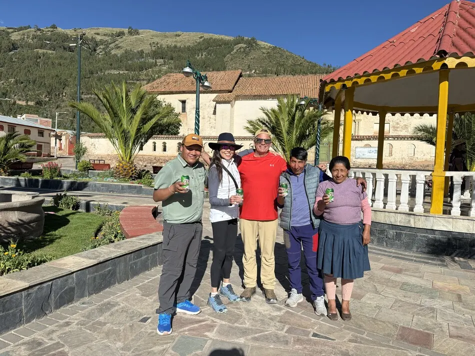 Happy hikers celebrating the end of the Ausangate Trek with a beer