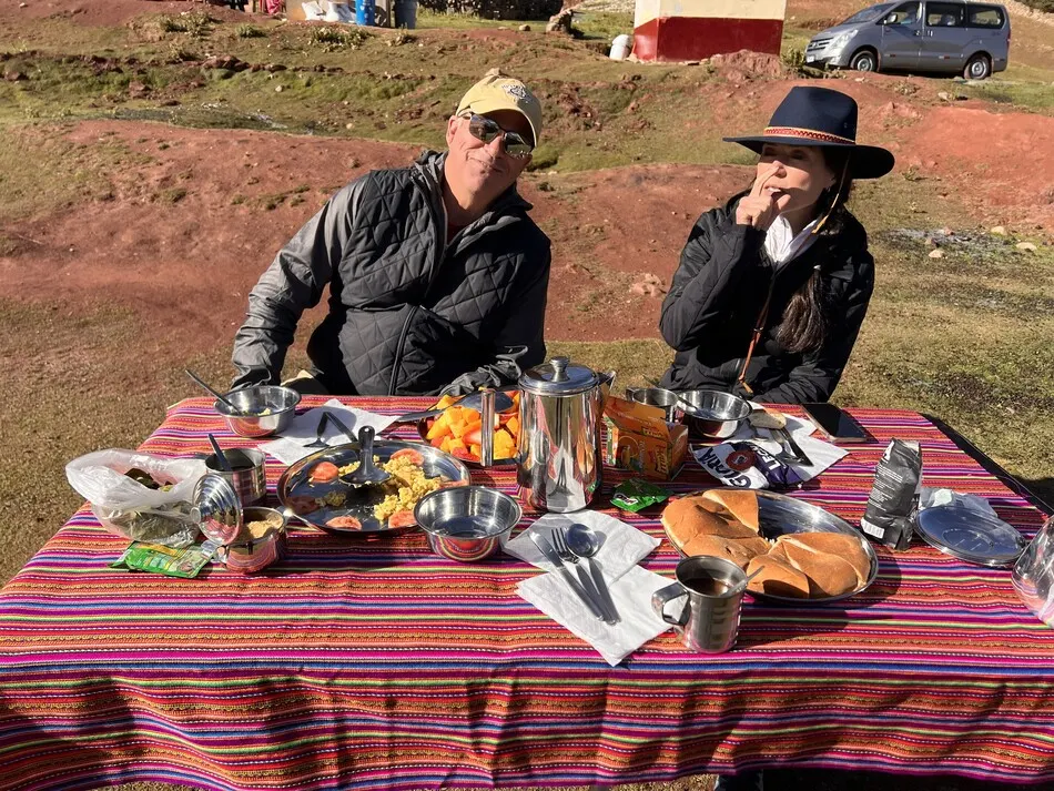 Hikers enjoying breakfast before starting the Ausangate Trek in Peru